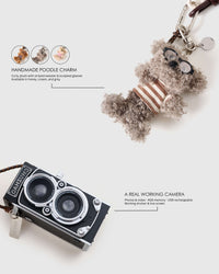 STICKYZOO POODLEGRAM plush poodle charm shown with its working mini camera — 4GB memory, USB rechargeable, in honey, cream and grey