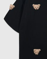 Detail of sleeve and body on STICKYZOO black Bear T-Shirt showing plush bear faces at different angles