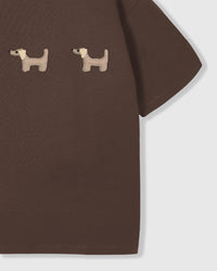Model wearing STICKYZOO Dachshund Trio T-Shirt in brown showing dropped shoulders