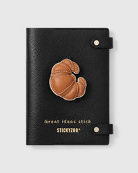 STICKYZOO Croissant Notebook with hand-cut French Alran leather charm on black genuine goatskin cover, gold snap closure