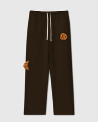 STICKYZOO Double Croissant Plush Sweatpants in brown with two hand-stitched golden plush croissants