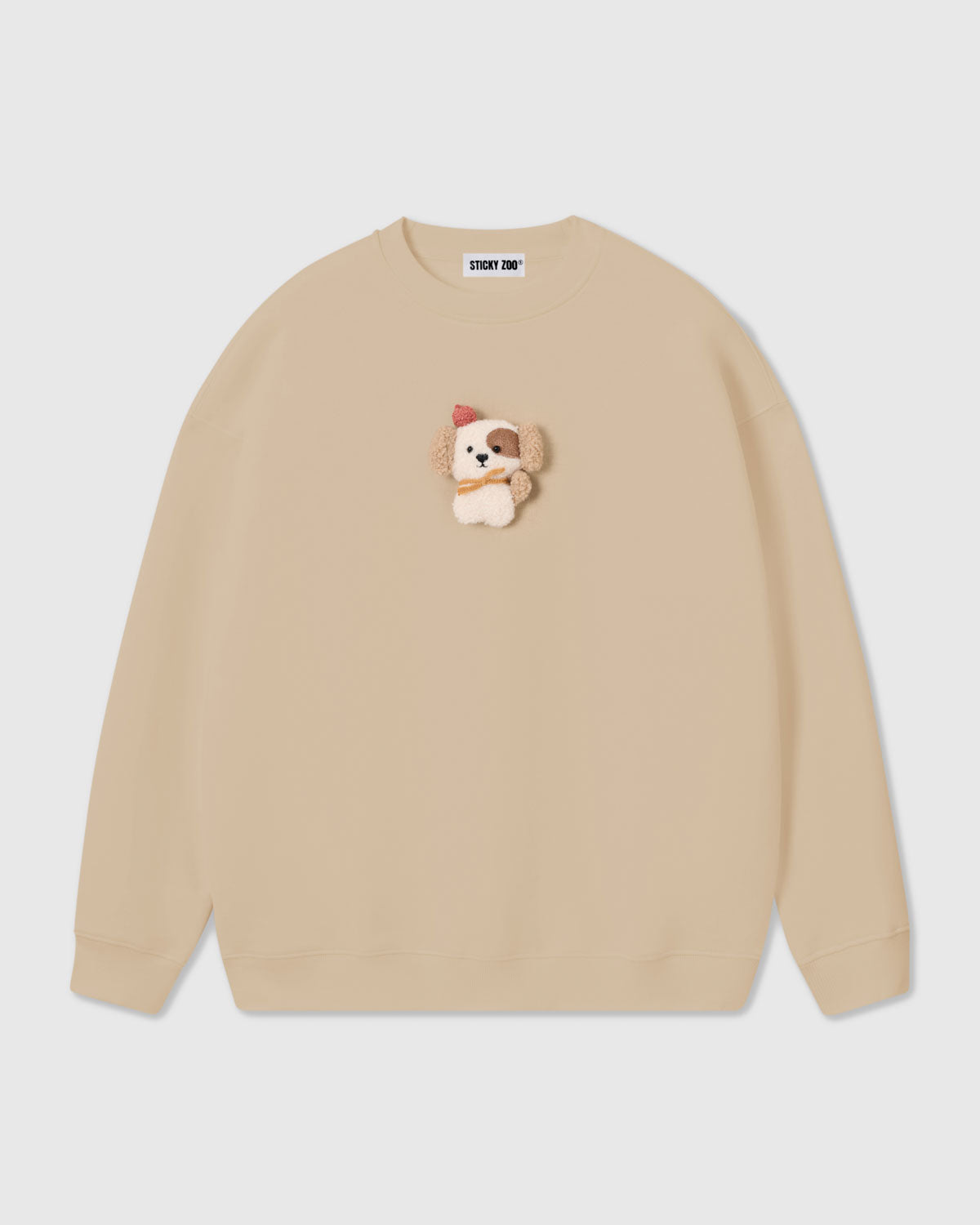 {{Plush puppy in cream}} STICKYZOO CARDINAL PUPPY SWEATSHIRT in Cream featuring one hand-stitched plush puppy appliqué, designed in Amsterdam