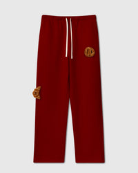 STICKYZOO Double Croissant Plush Sweatpants in red with two hand-stitched 3D plush croissants