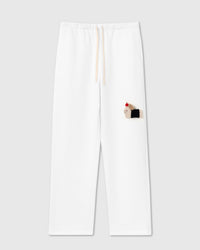 STICKYZOO DACHSHUND APPLE SWEATPANTS featuring one hand-stitched plush dachshund appliqué, designed in Amsterdam