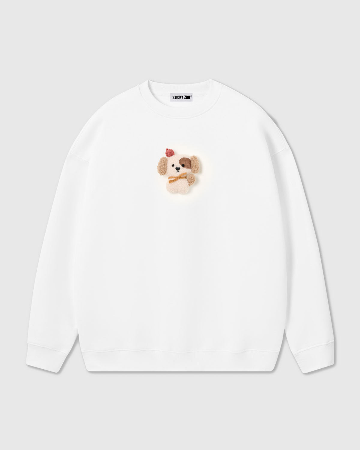 {{Plush puppy in white}} STICKYZOO CARDINAL PUPPY SWEATSHIRT in White featuring one hand-stitched plush puppy appliqué, designed in Amsterdam