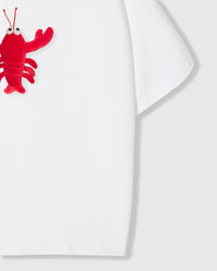 Model wearing STICKYZOO Shrimp Hug T-Shirt in white showing dropped shoulders and shrimp placement