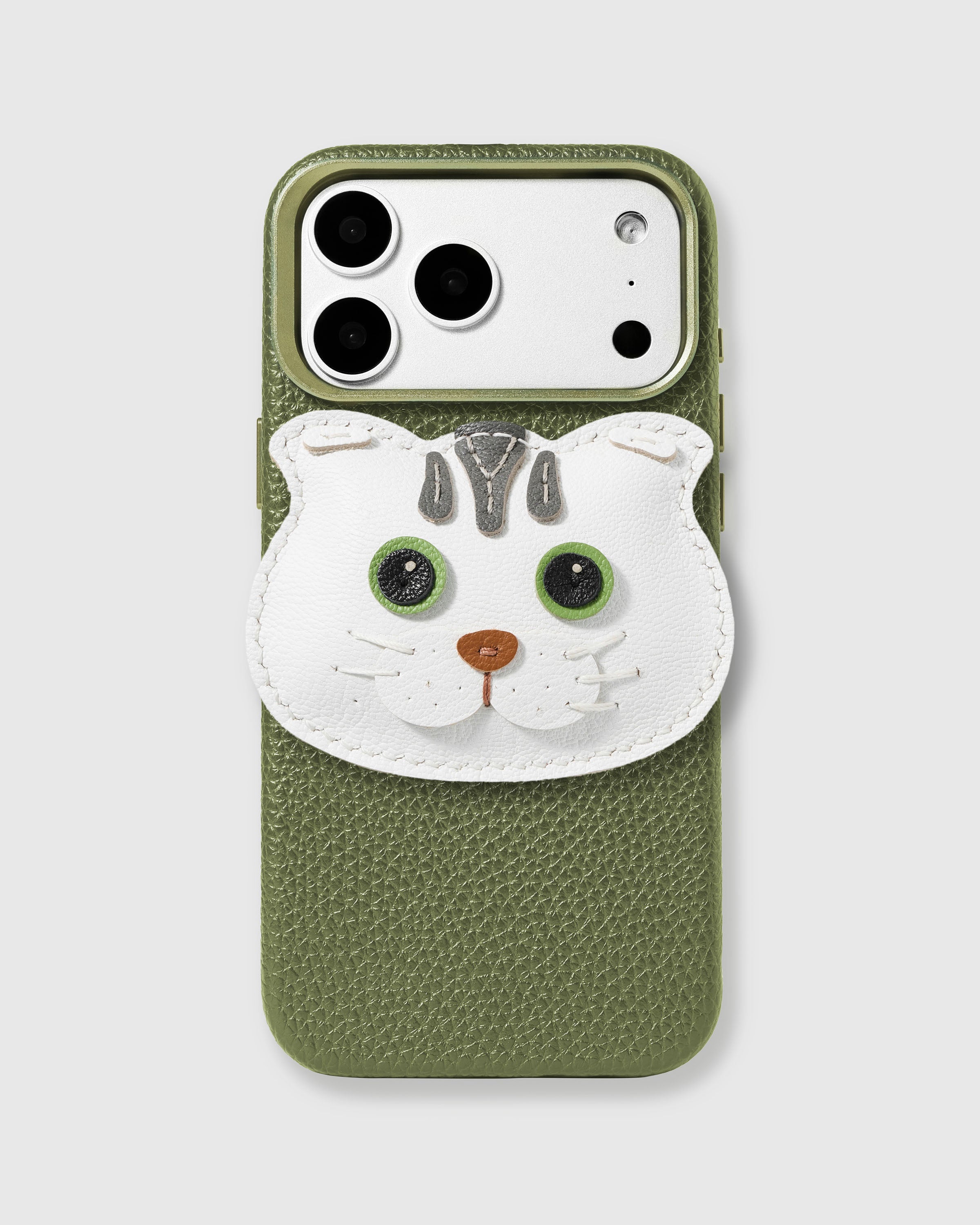 STICKYZOO Scottish Fold Cat Charm Case in olive green with 3D handmade French Alran leather cat charm featuring folded ears, green eyes, and grey tabby markings.