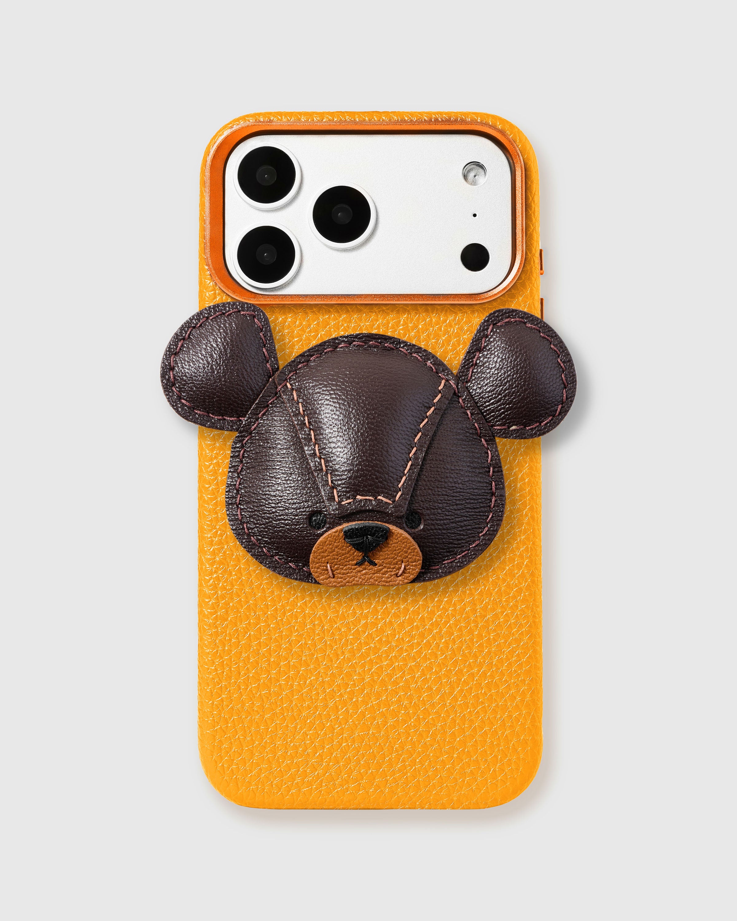 STICKYZOO Bear Charm Case in yellow with 3D handmade French Alran leather bear charm in dark brown with hand-stitched ears and tan snout.