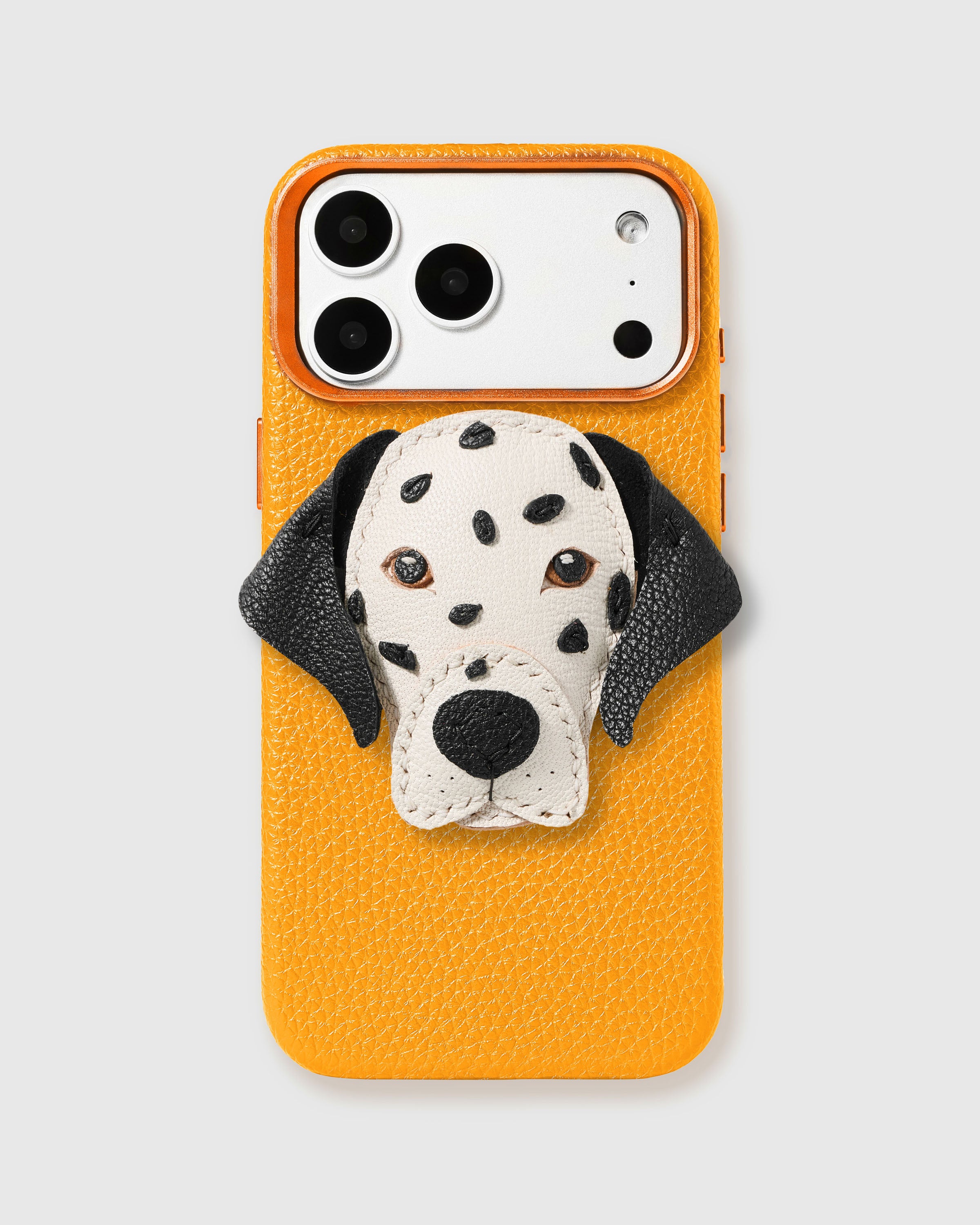 STICKYZOO Dalmatian Charm Case in yellow with 3D handmade French Alran leather dalmatian charm with spotted white face and black floppy ears.