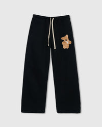 STICKYZOO TEDDY BEAR SWEATPANT in Black featuring one hand-stitched plush teddy bear appliqué, designed in Amsterdam