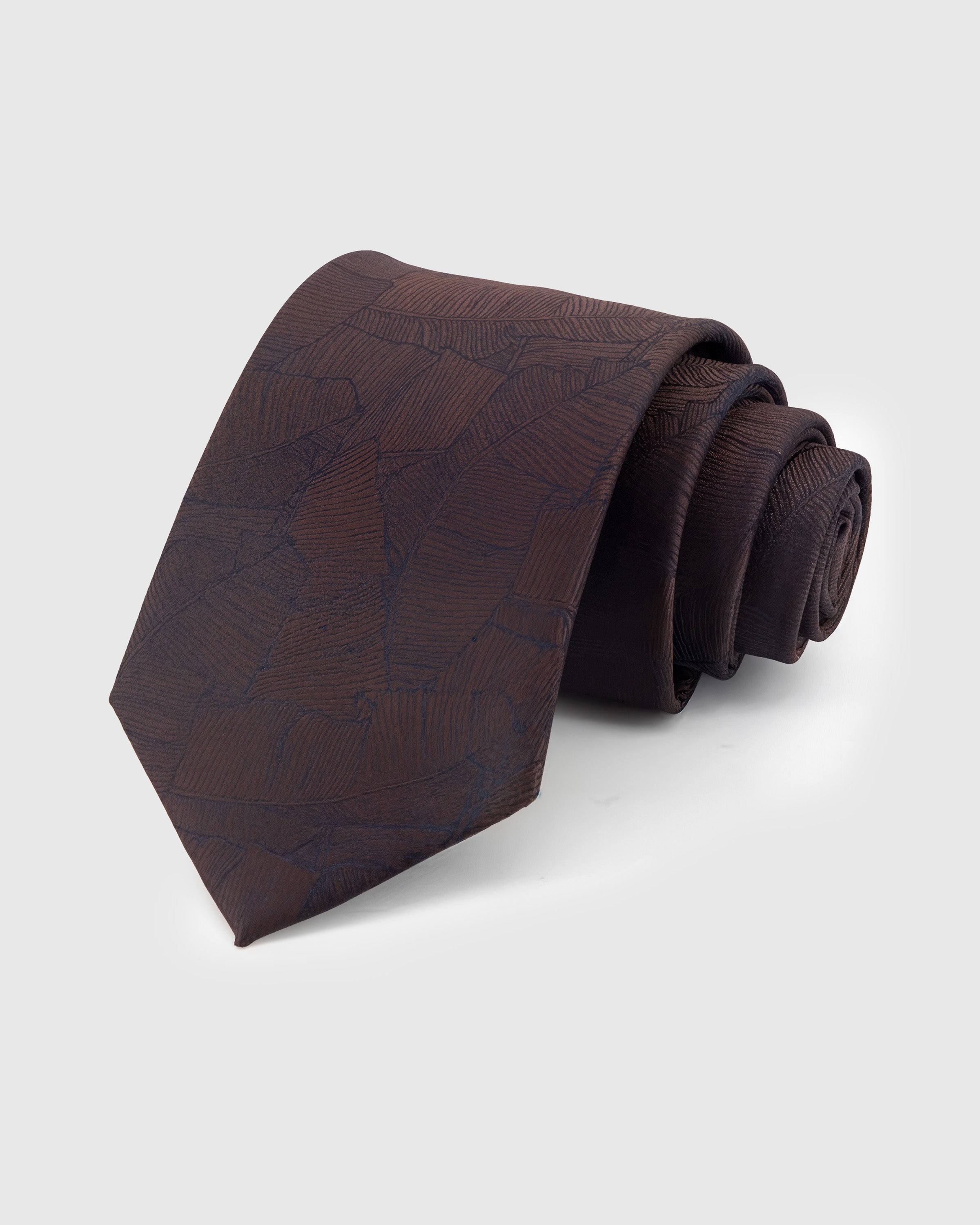 COCOA MOSAIC TIE — Hand-embroidered abstract mosaic detail on 100% mulberry silk in cocoa, showing embroidery texture and silk sheen