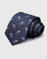 100% mulberry silk STICKYZOO Alpine Skier Tie in navy with hand-embroidered ski jumper motifs in blue and orange thread, rolled