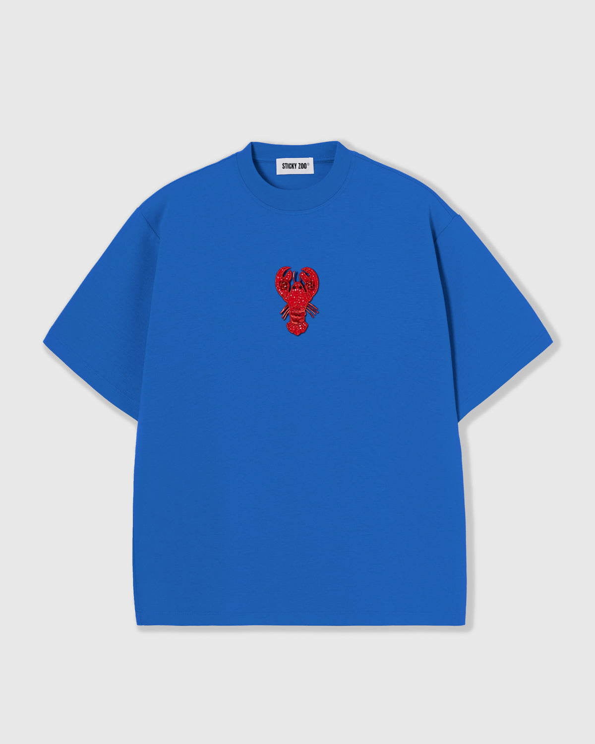 STICKYZOO Lobster T-Shirt in blue with a hand-beaded red lobster applique, oversized unisex fit.