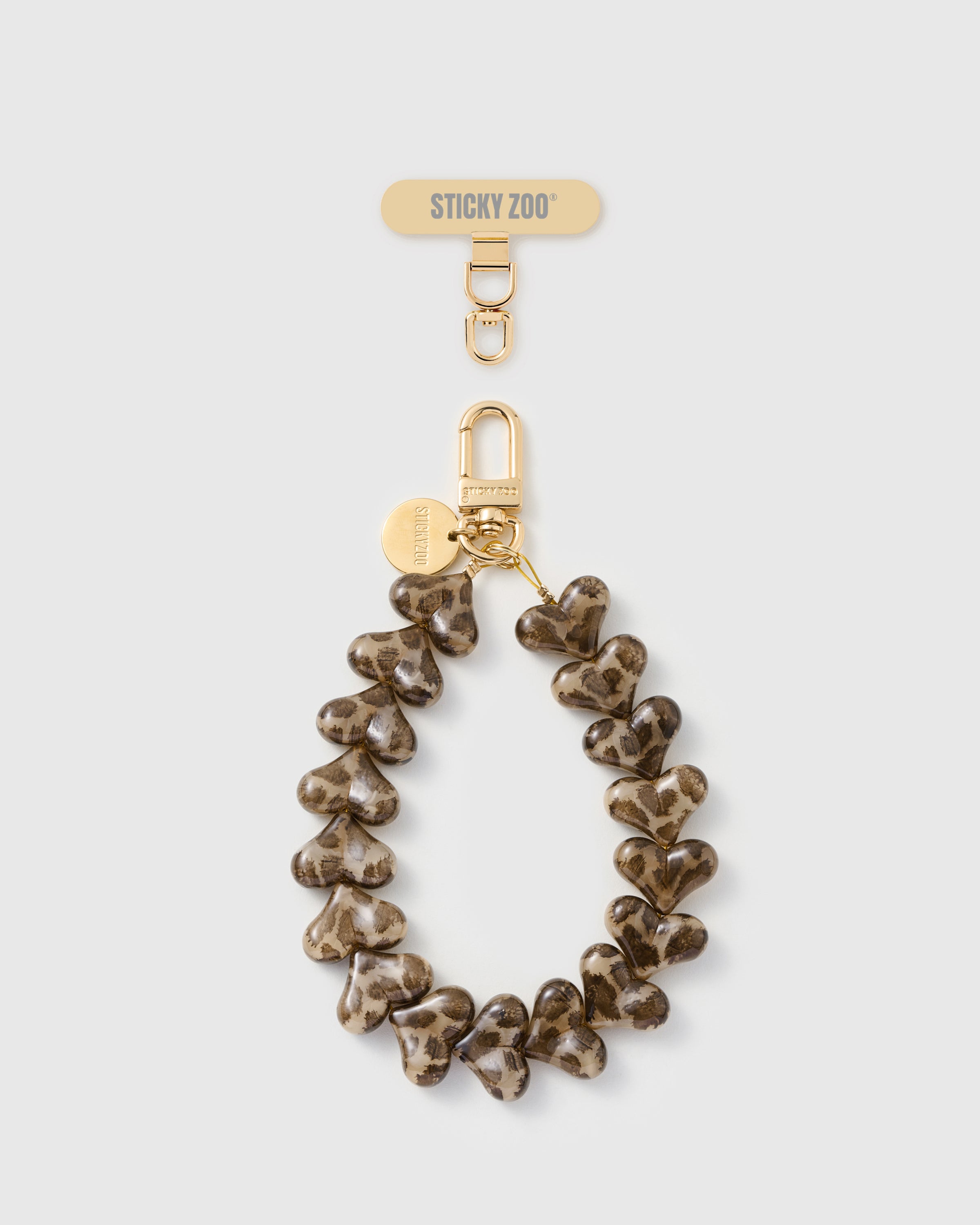 Rated 4.9 stars STICKYZOO smoke leopard heart phone strap with translucent heart beads showing leopard print embedded in the resin and gold hardware