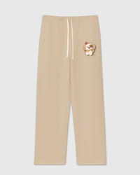 STICKYZOO CARDINAL PUPPY SWEATPANT in Cream featuring one hand-stitched plush puppy appliqué, designed in Amsterdam
