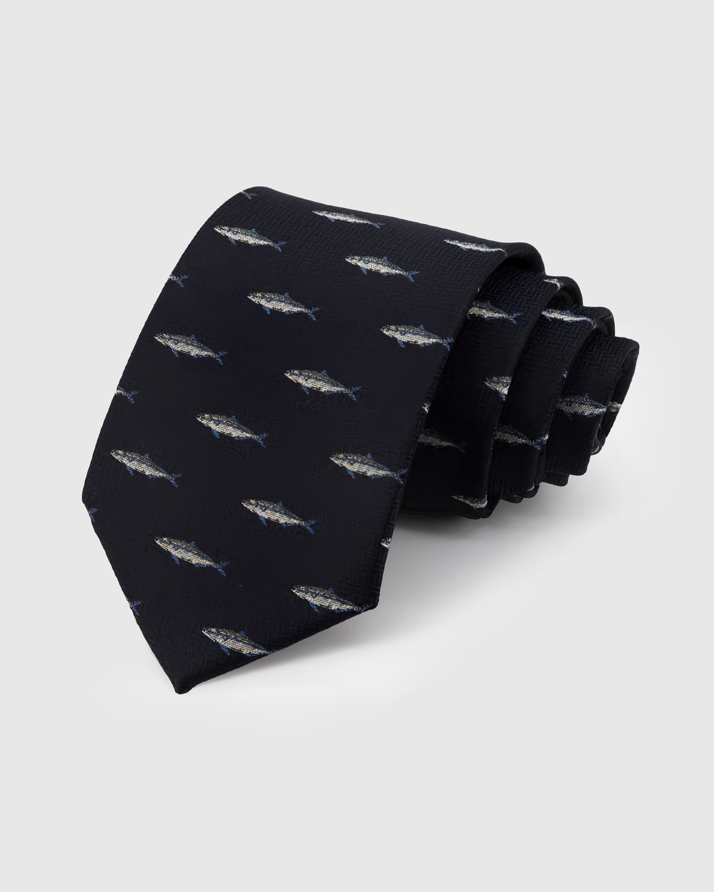 STICKYZOO Midnight Trout Tie in hand-embroidered mulberry silk with silver trout motifs on midnight herringbone ground, 45° bias-cut Italian method