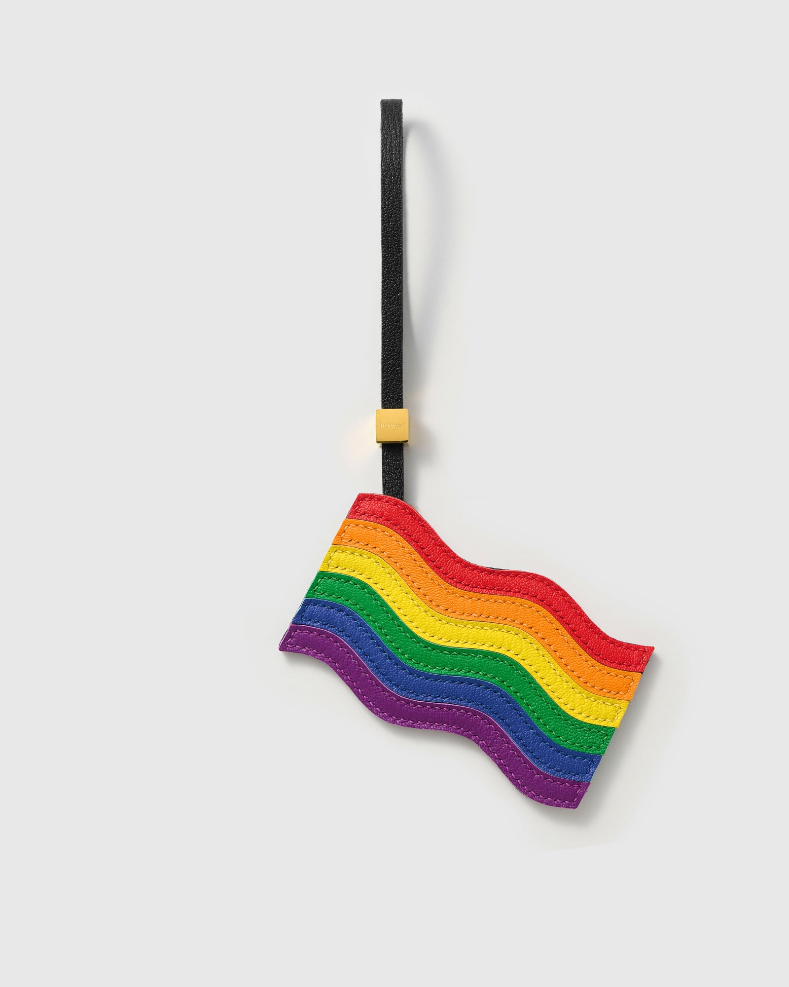 {{Love is love}} Handmade pride flag bag charm in French Alran leather — six rainbow colours in waving flag silhouette by STICKYZOO