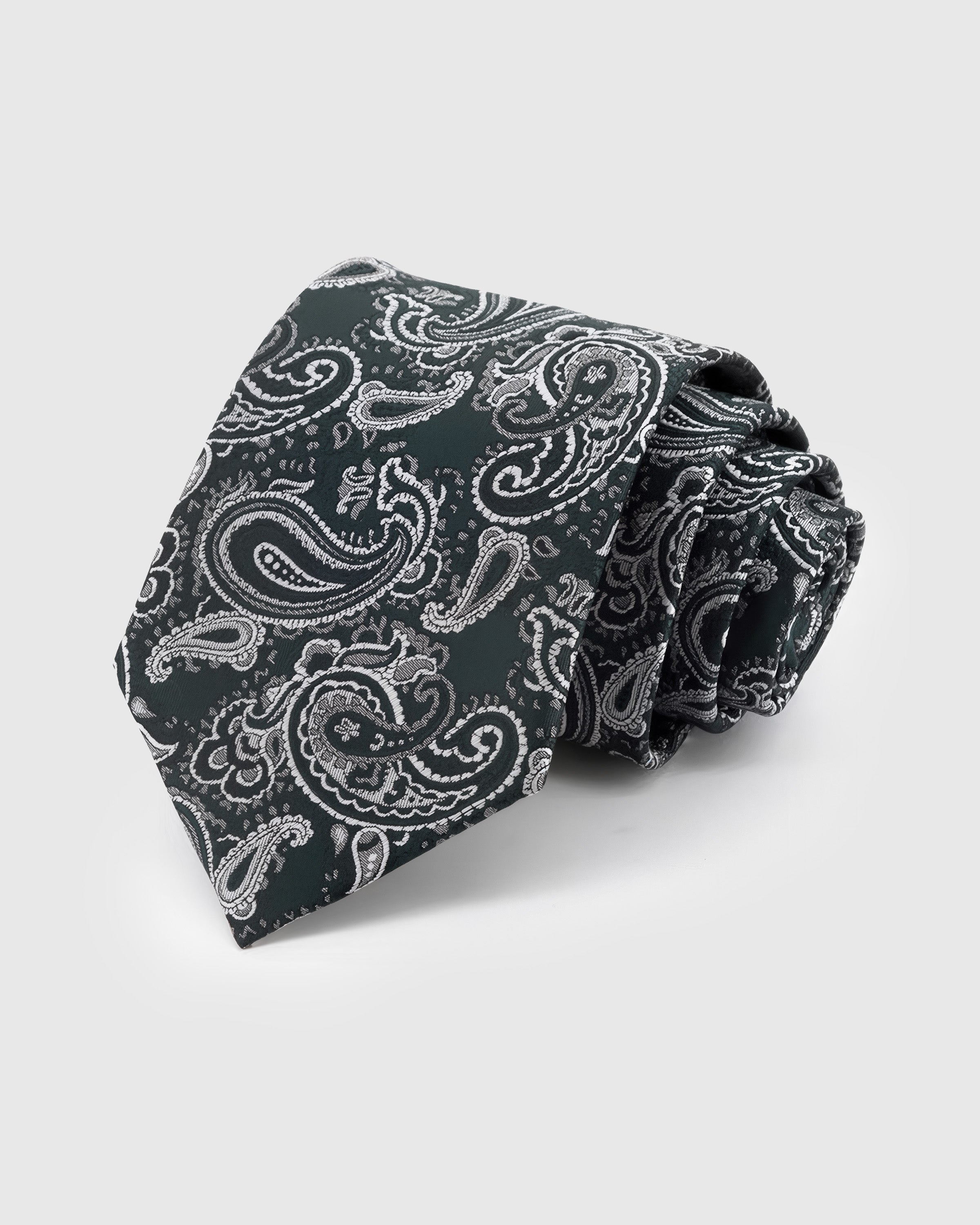 EVERGREEN PAISLEY TIE — Hand-embroidered paisley detail on 100% mulberry silk in evergreen, showing embroidery texture and silk sheen