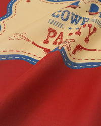 Close-up of the ivory paisley corner on the silk scarf showing the inked detail and stitched hem
```