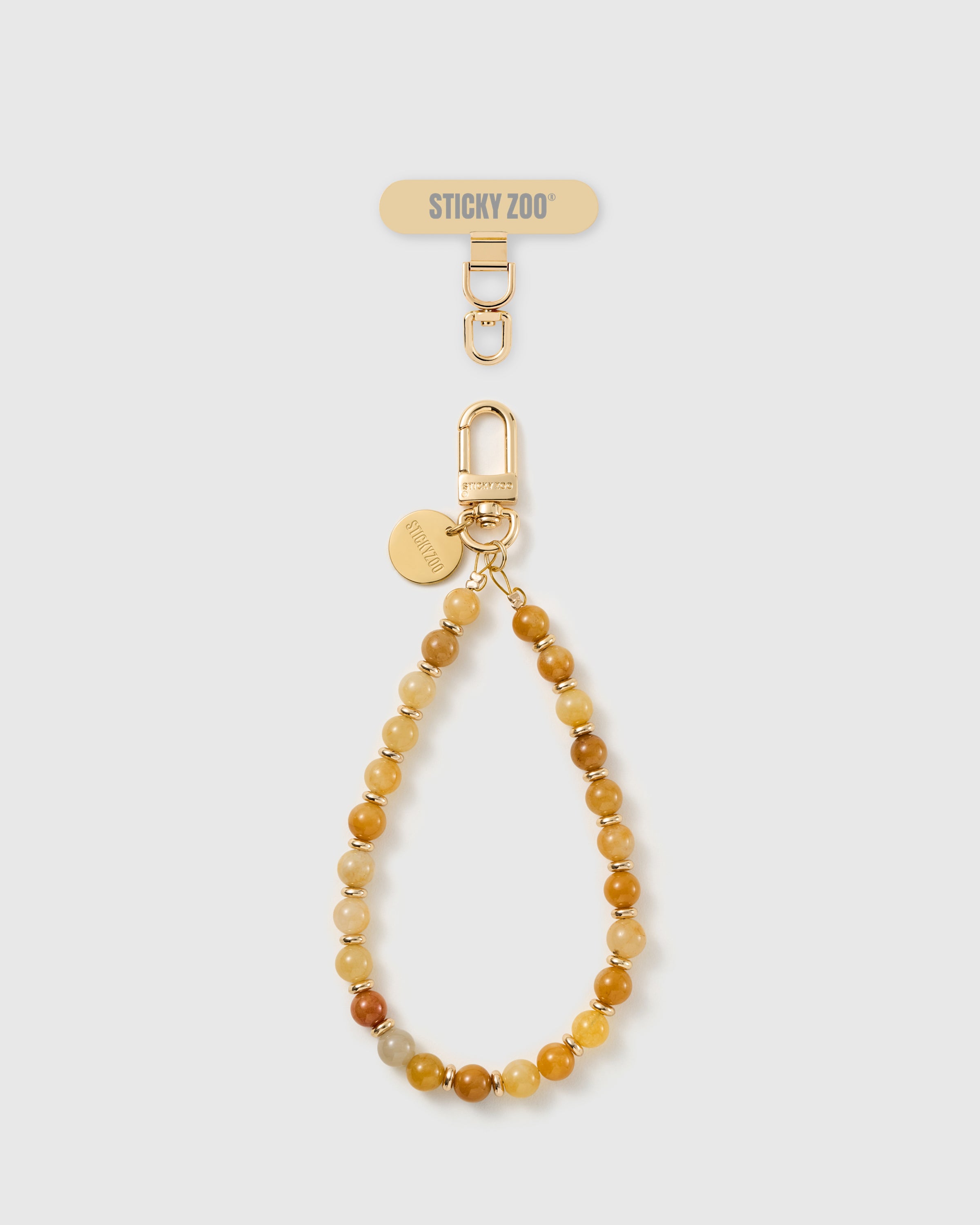 STICKYZOO handmade phone strap in honey-toned real stone beads with an 18K gold-plated Phone Strap Card tab, shown full length