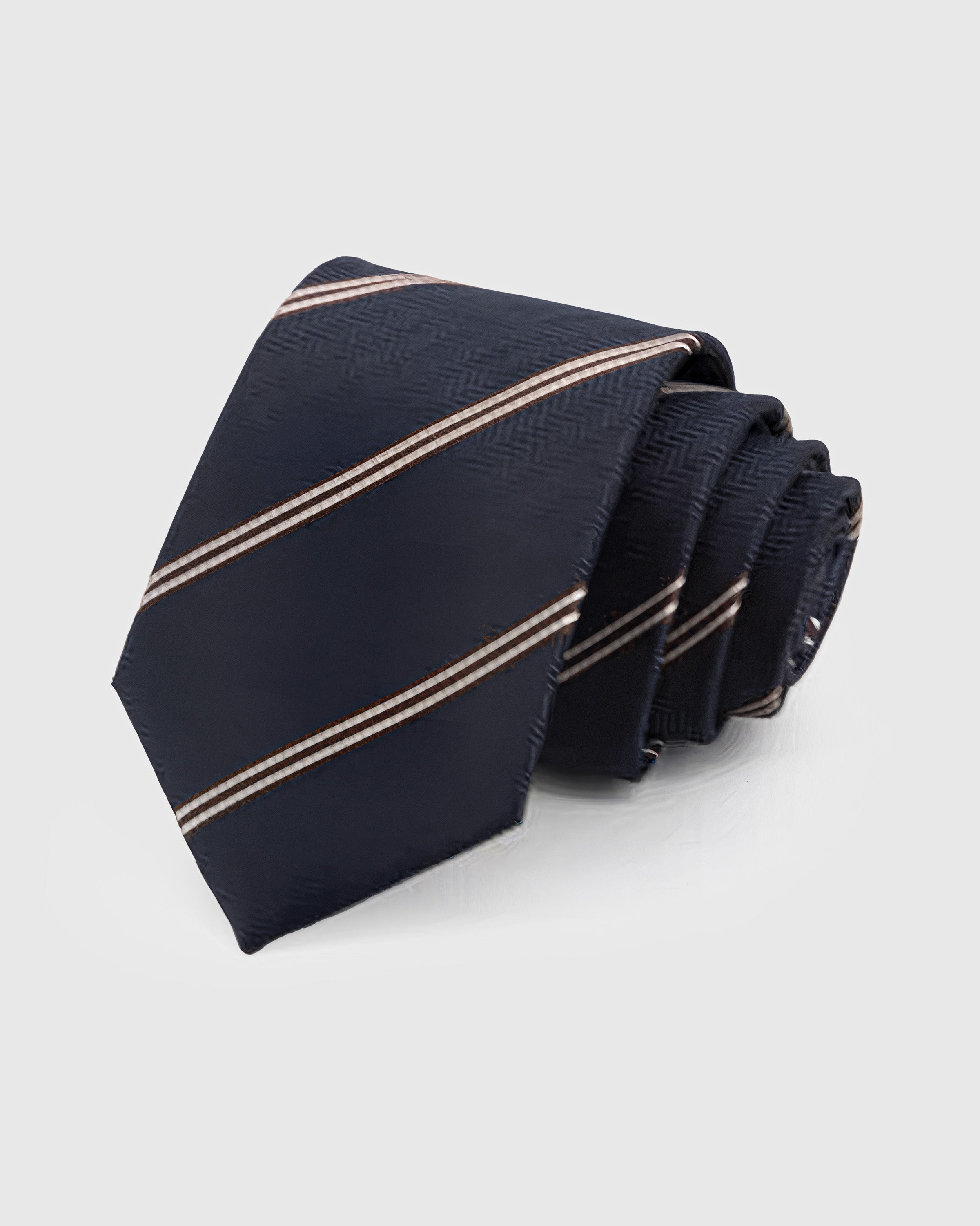 STICKYZOO Midnight Copper Tie in hand-embroidered mulberry silk with copper accent stripes on deep navy herringbone ground, 45° bias-cut