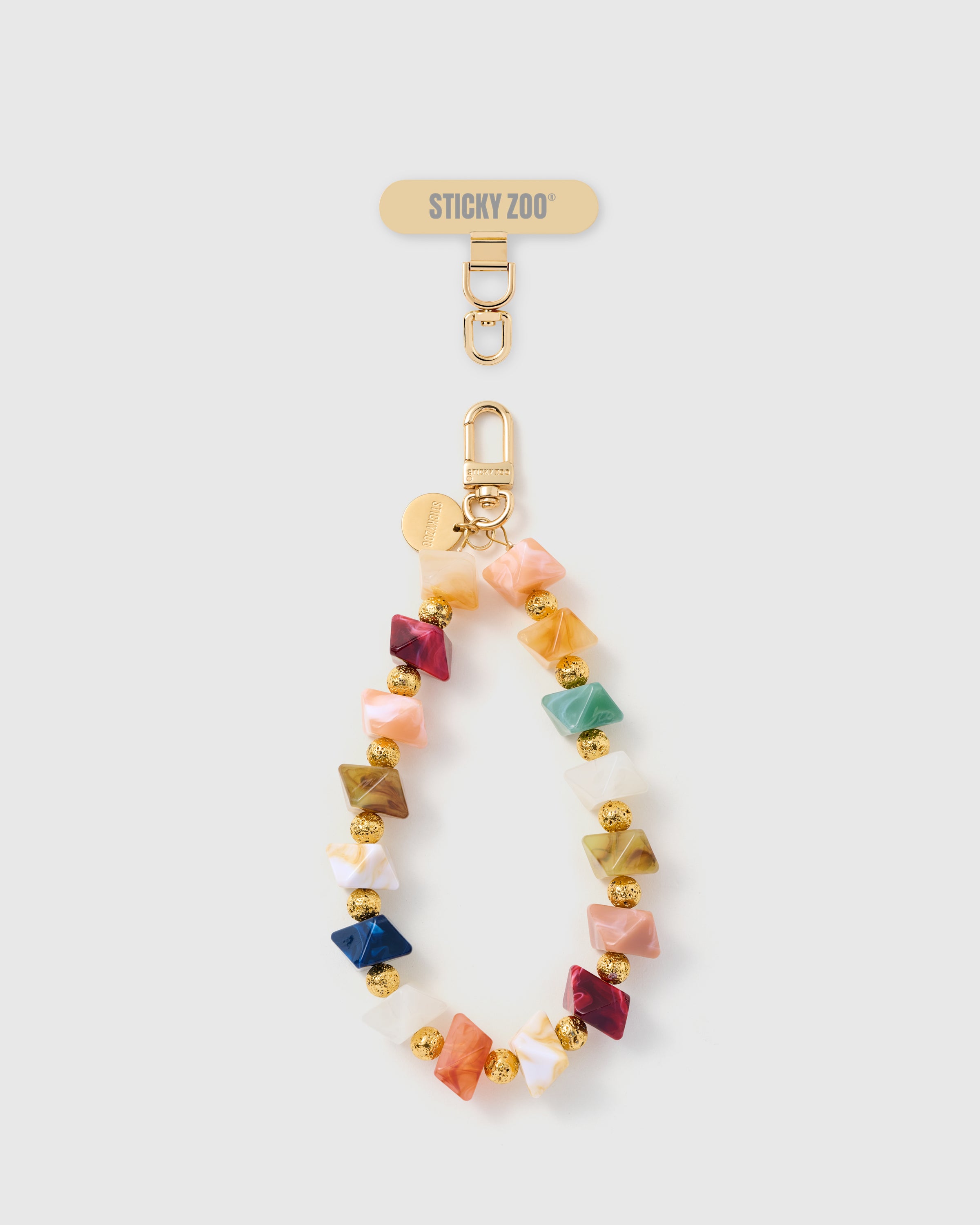 No two beads alike — marbled resin bicone bead phone strap in jewel tones with gold-textured spacers and engraved STICKYZOO disc