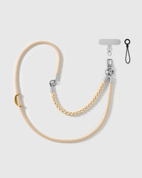 Sand braided phone strap by STICKYZOO, worn as a wrist strap or cross-body, with silver-tone swivel hooks, a phone-tab connector and safety tether