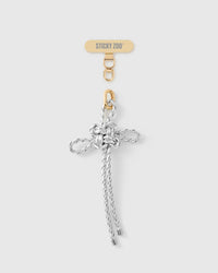 Pearl-white hand-knotted braided bow phone strap with 18K gold-plated engraved hardware by STICKYZOO