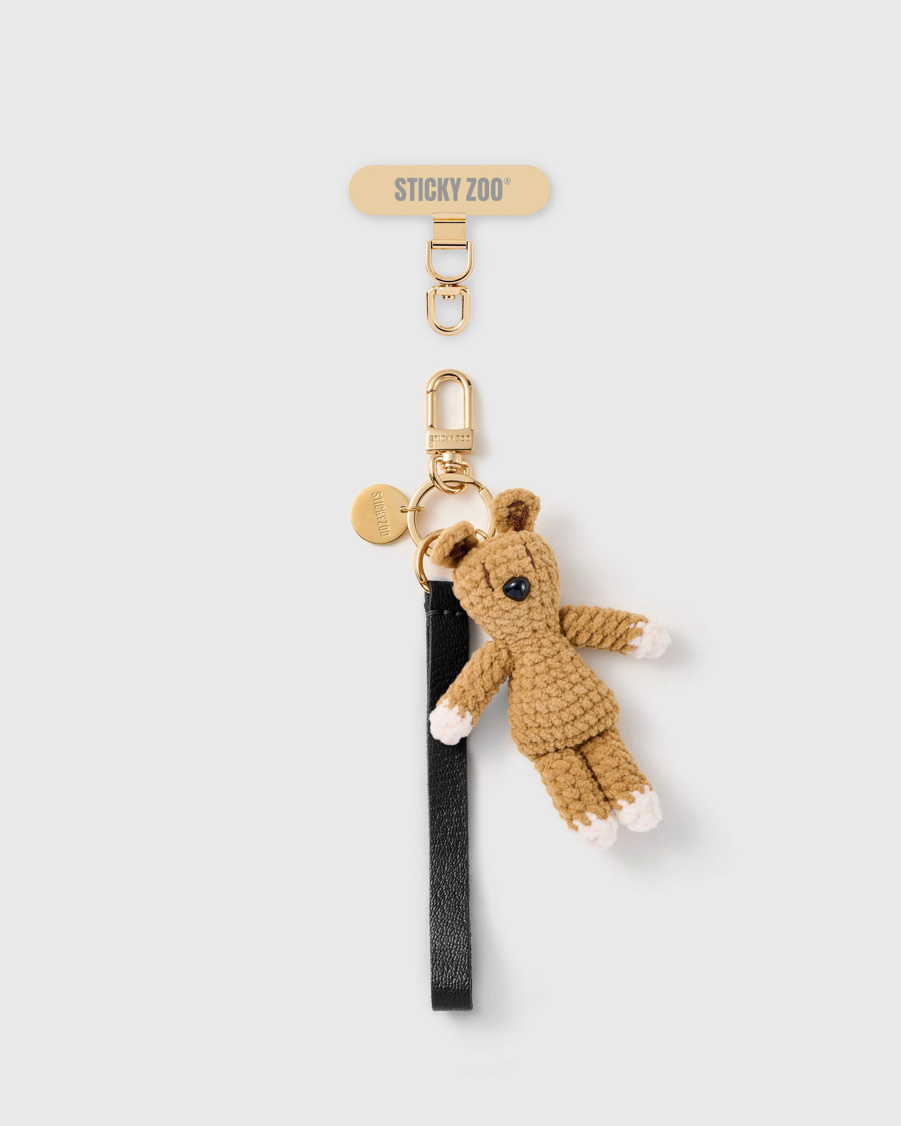 Handmade French Alran jet black leather phone strap with hand-crochet beige bunny charm and 18K gold STICKYZOO hardware