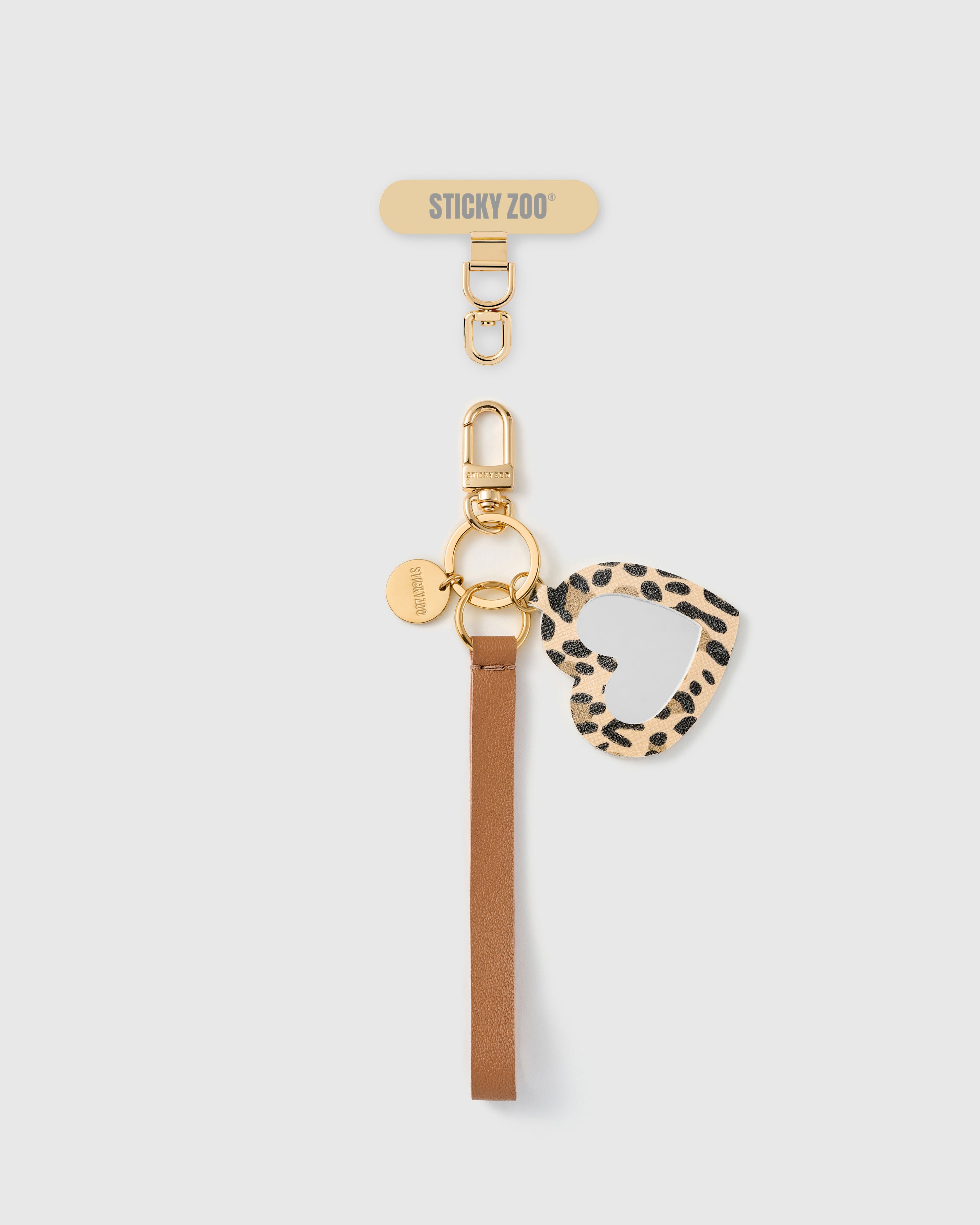 Handmade French Alran cocoa tan leather phone strap with leopard-print calf-hair heart mirror charm and 18K gold STICKYZOO hardware