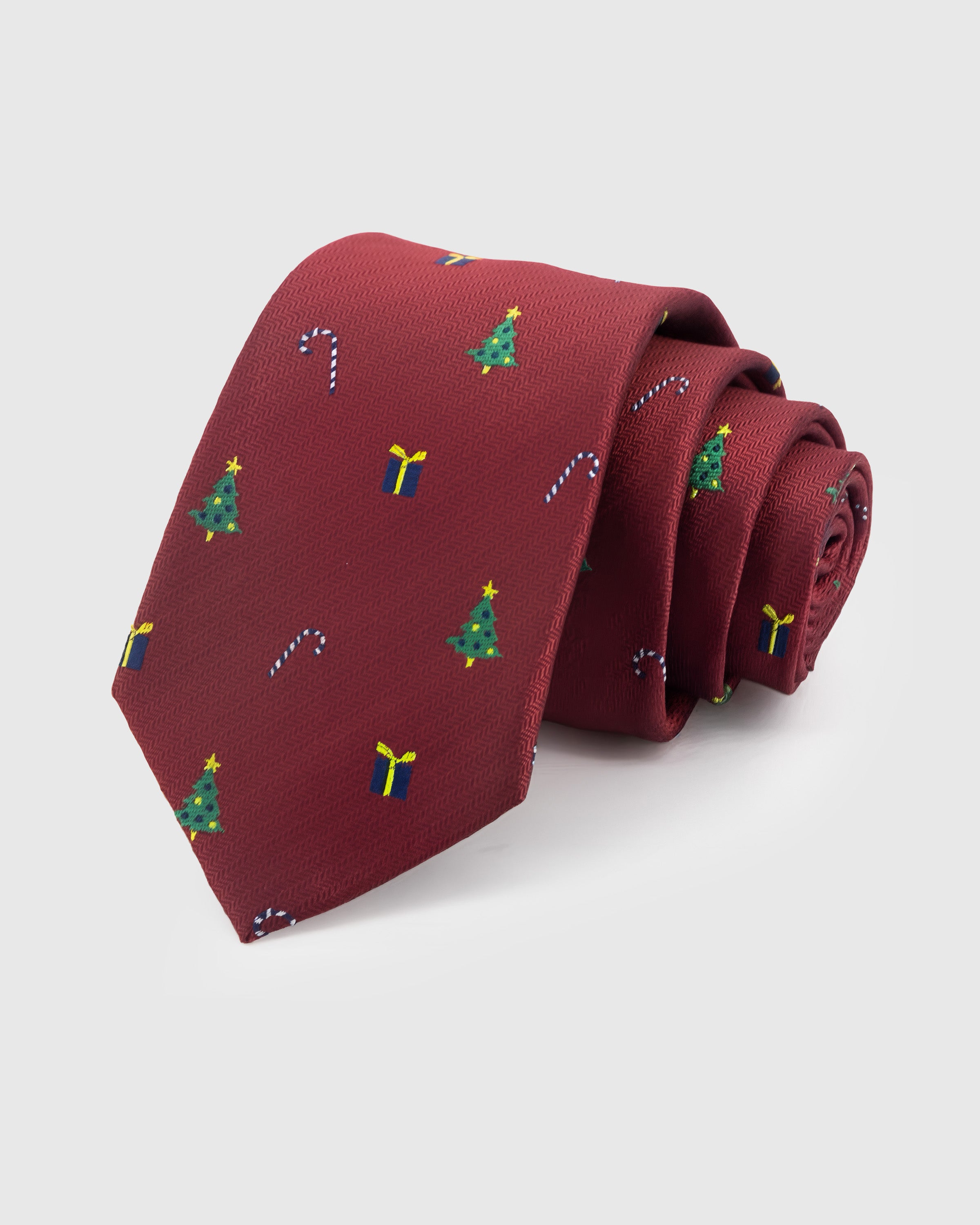 STICKYZOO Crimson Holiday Tie in hand-embroidered mulberry silk with festive trees, candy canes, and gift motifs, 45° bias-cut