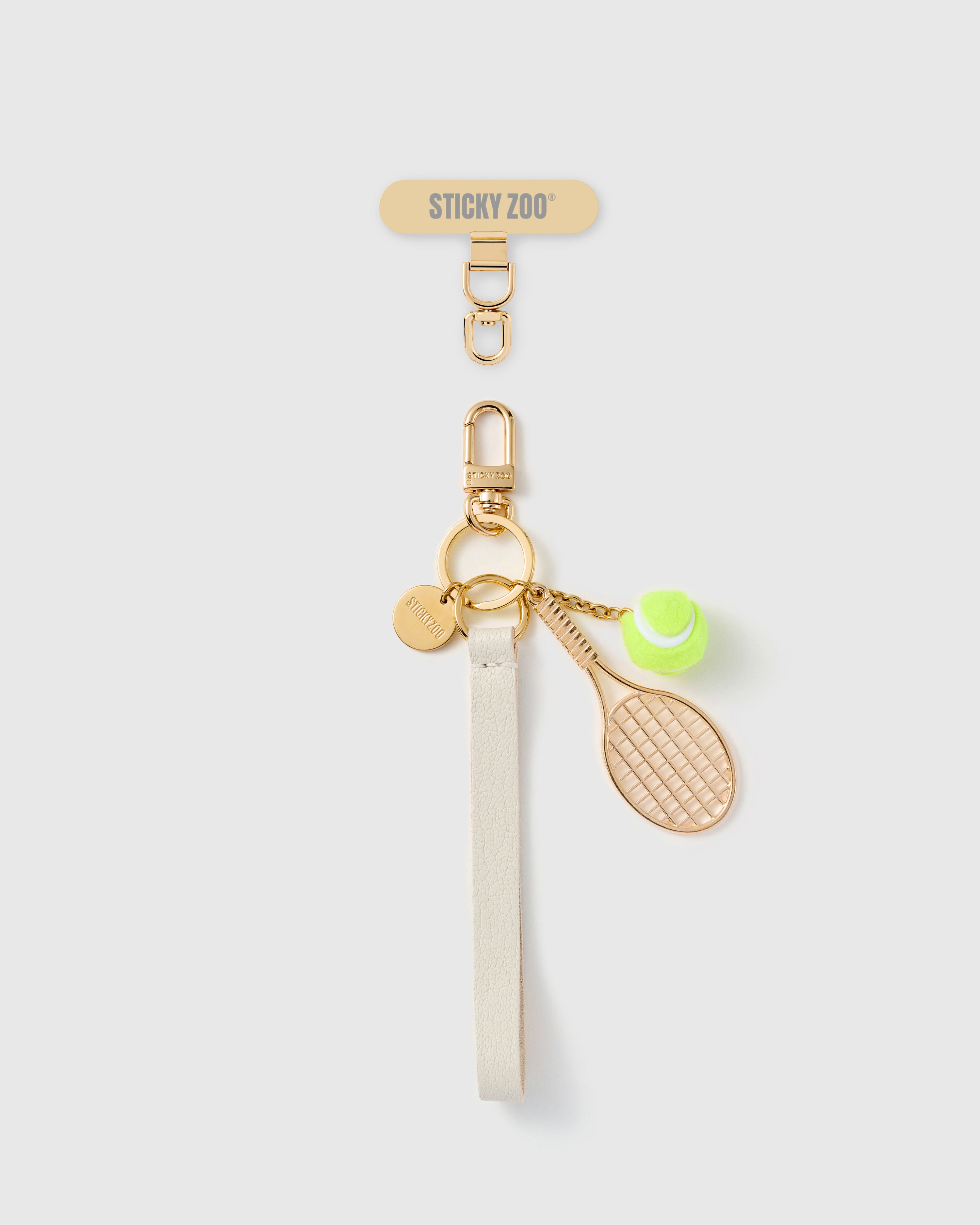 Handmade French Alran ivory leather phone strap with gold tennis racquet and hand-felted tennis ball charms, 18K gold STICKYZOO hardware