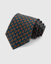 STICKYZOO TEAL FOULARD TIE — 100% mulberry silk with hand-embroidered amber and terracotta petal foulard motifs on deep teal blue ground