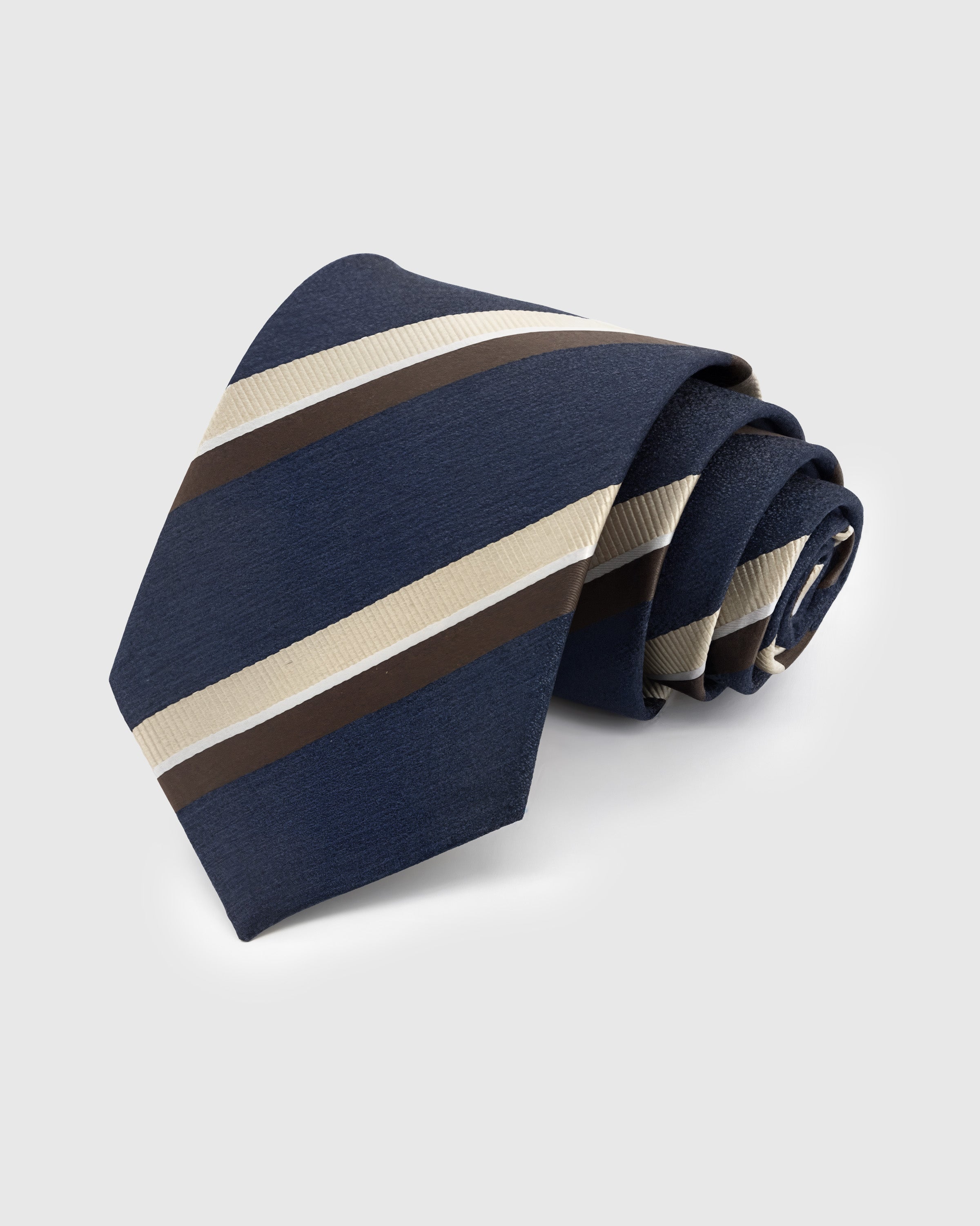 NAVY CLUB STRIPE TIE — Hand-embroidered regimental stripe detail on 100% mulberry silk in navy, showing embroidery texture and silk sheen