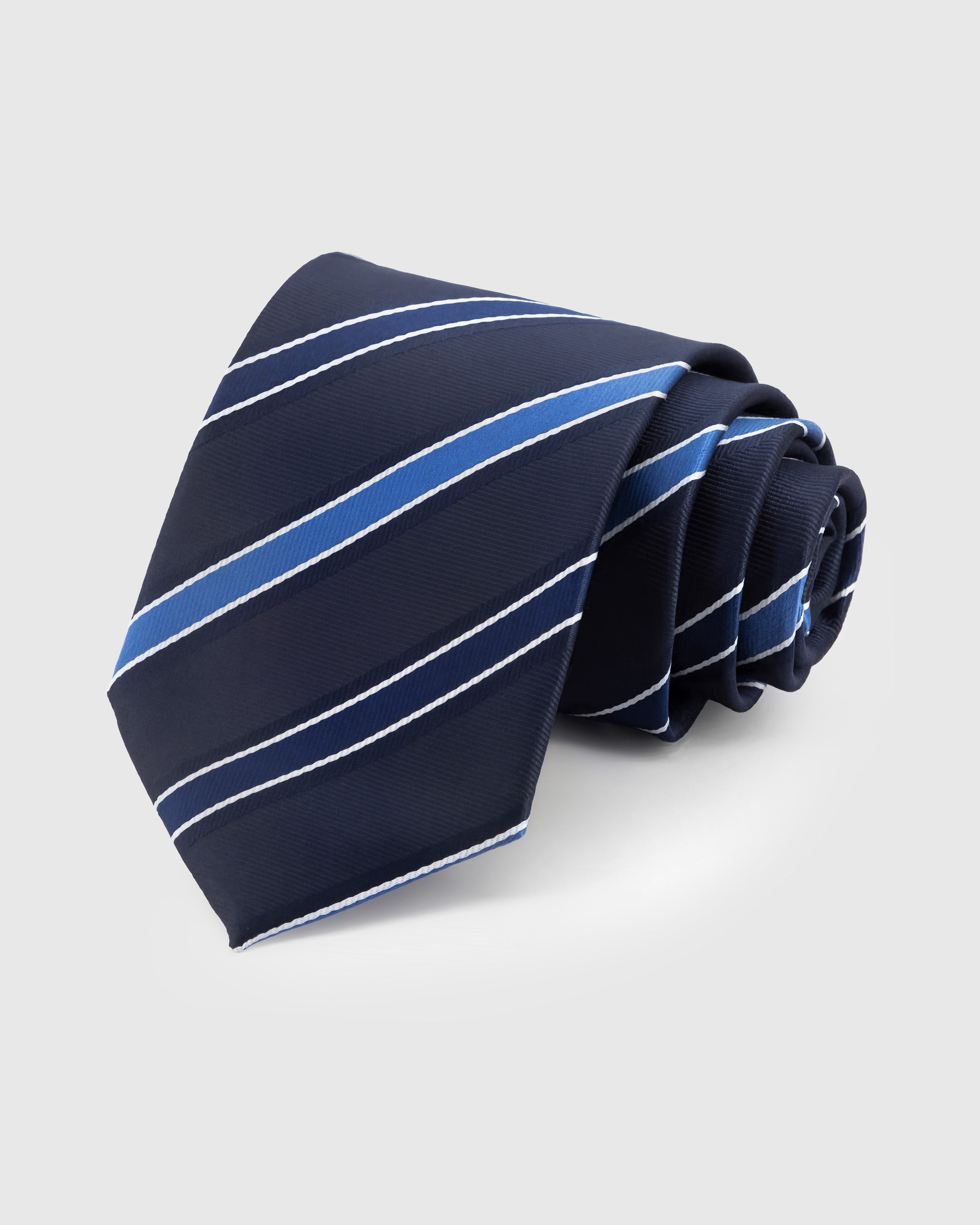 STICKYZOO Midnight Cobalt Stripe Tie in mulberry silk with bright cobalt and white diagonal stripes on midnight ground, 45° bias-cut