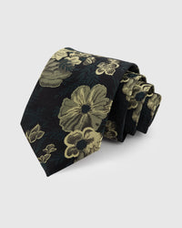 STICKYZOO NOIR BOTANICAL TIE — 100% mulberry silk with hand-embroidered gold-toned botanical blooms and foliage on deep black with dark green undertones ground
