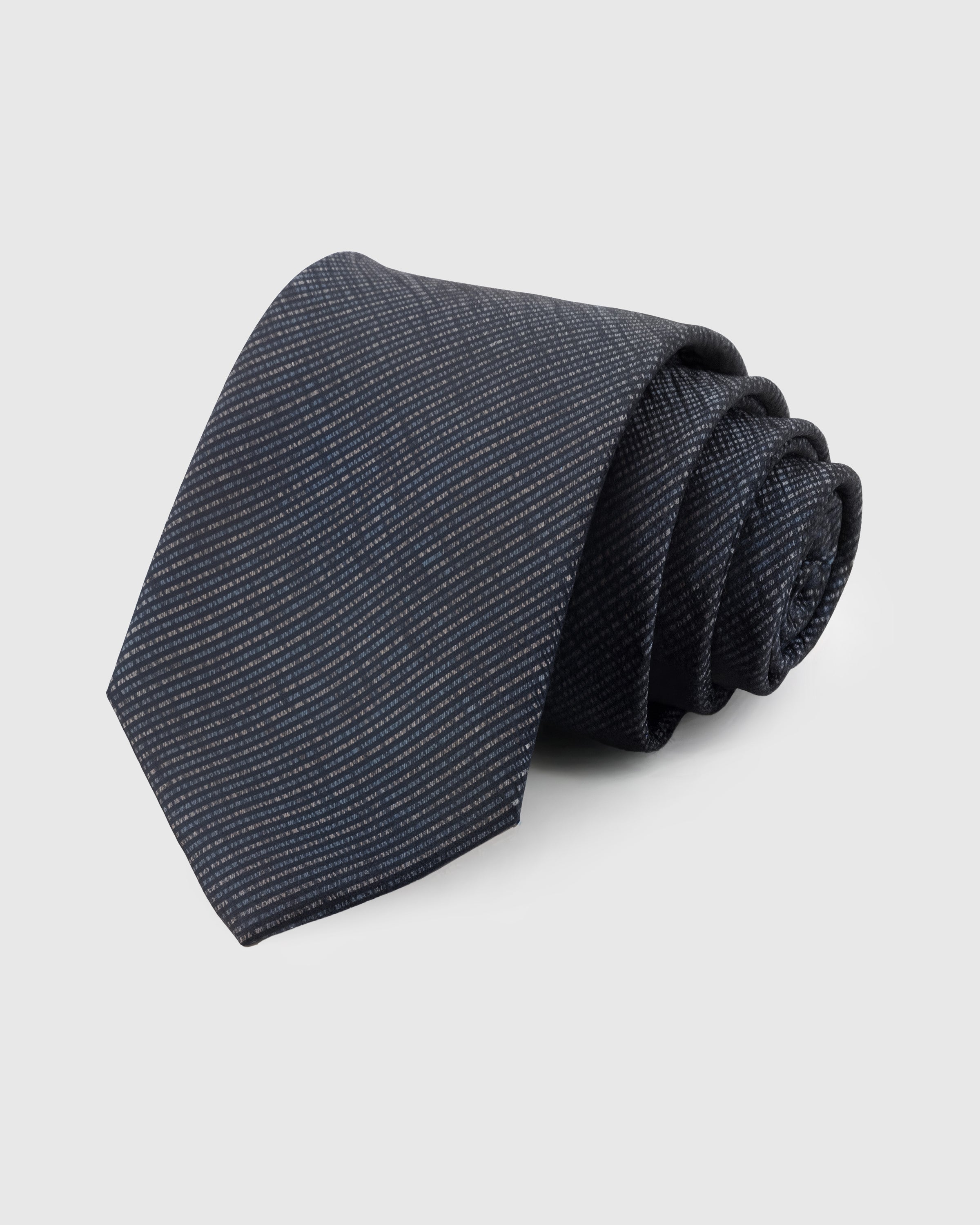 STICKYZOO Graphite Textured Tie in 100% mulberry silk with micro textured tonal check pattern on charcoal-navy ground, 45° bias-cut