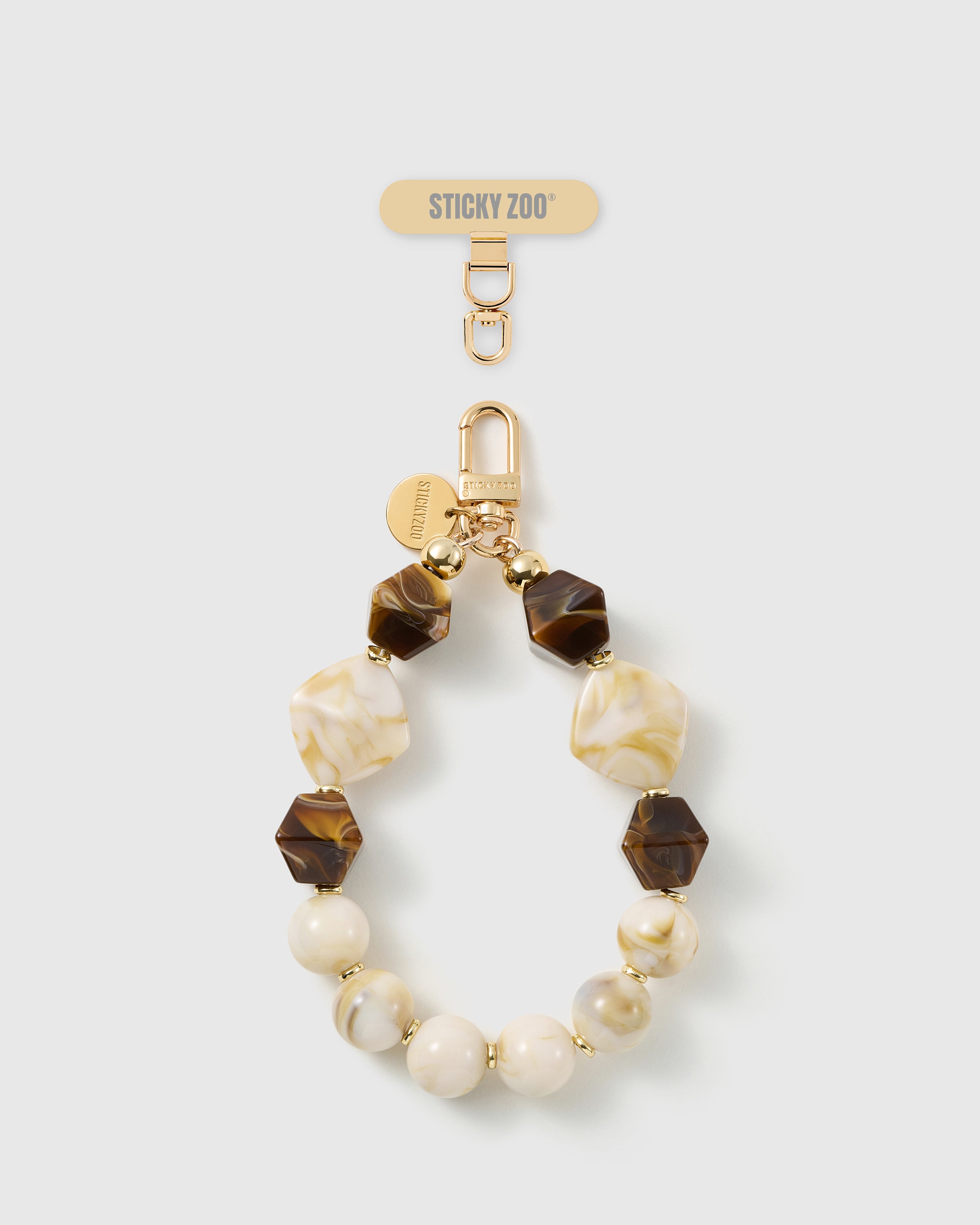 Handmade mocha marbled bead phone strap by STICKYZOO with 18K gold-plated engraved hardware
