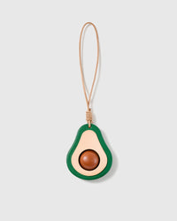 Handmade French Alran goatskin leather avocado bag charm, halved with a domed centre, on a natural leather cord by STICKYZOO