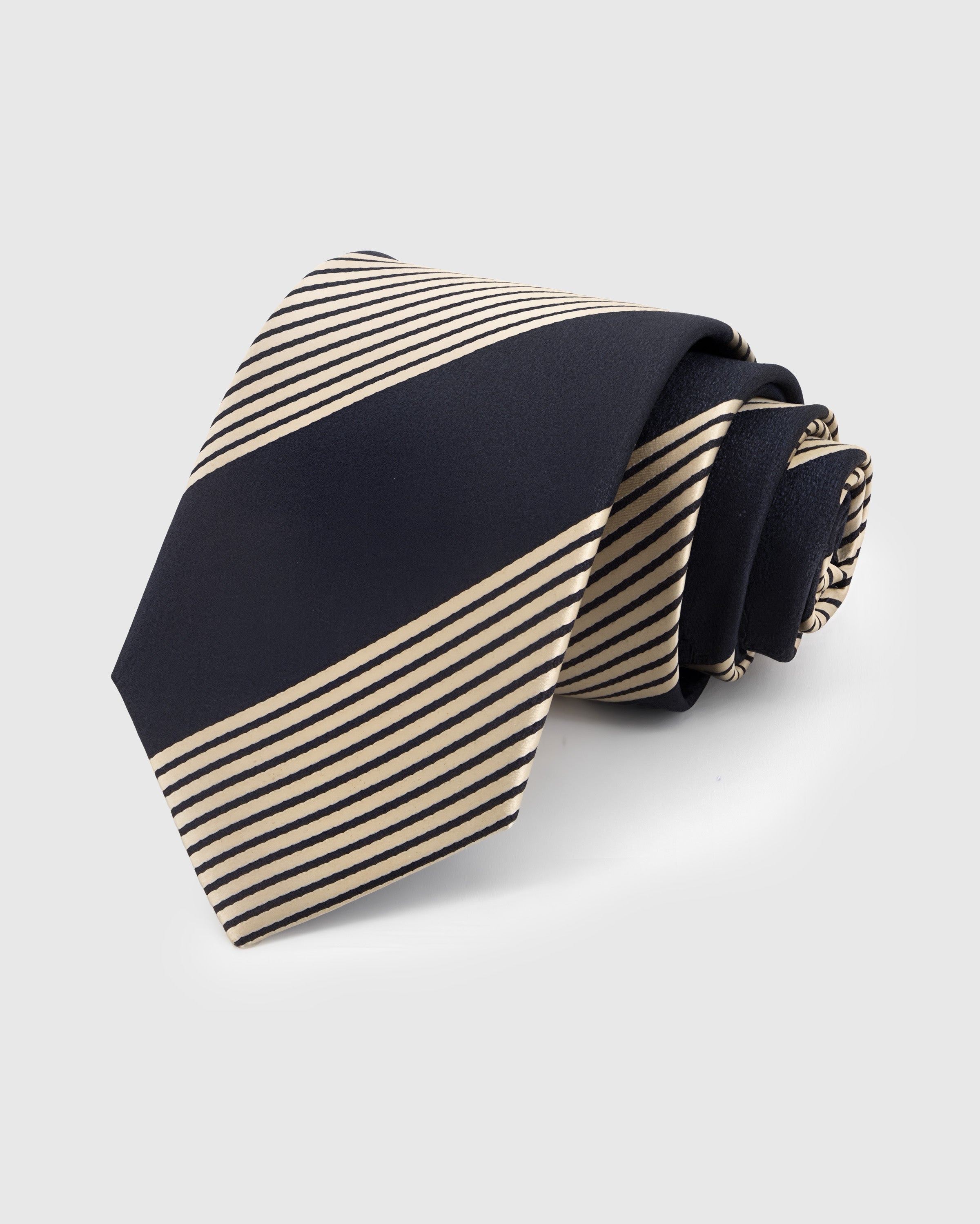 MIDNIGHT BLOCK STRIPE TIE — Hand-embroidered block stripe detail on 100% mulberry silk in midnight navy, showing embroidery texture and silk sheen