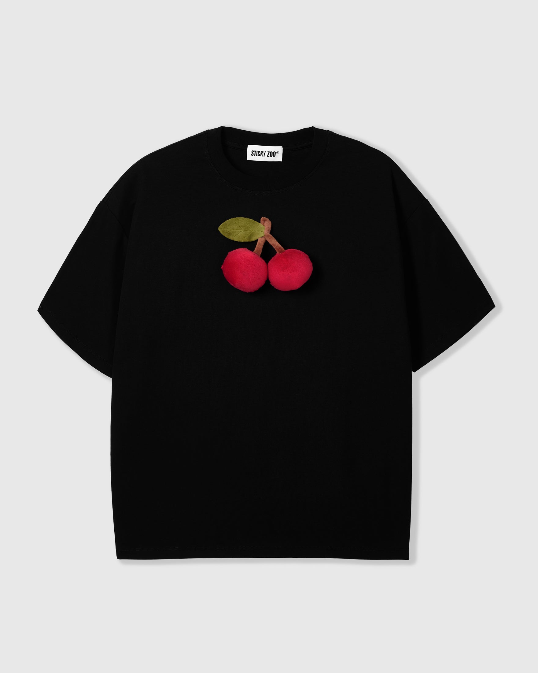 STICKYZOO Cherry T-Shirt in black with 3D hand-stitched plush cherry appliqué and green felt leaf