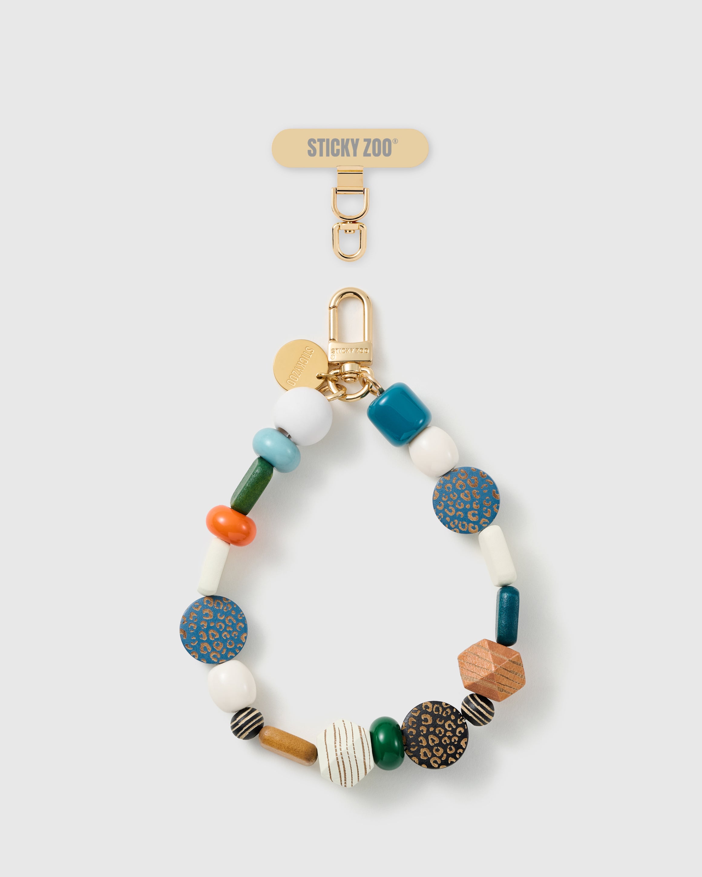 Handmade mixed safari bead phone strap by STICKYZOO with 18K gold-plated engraved hardware