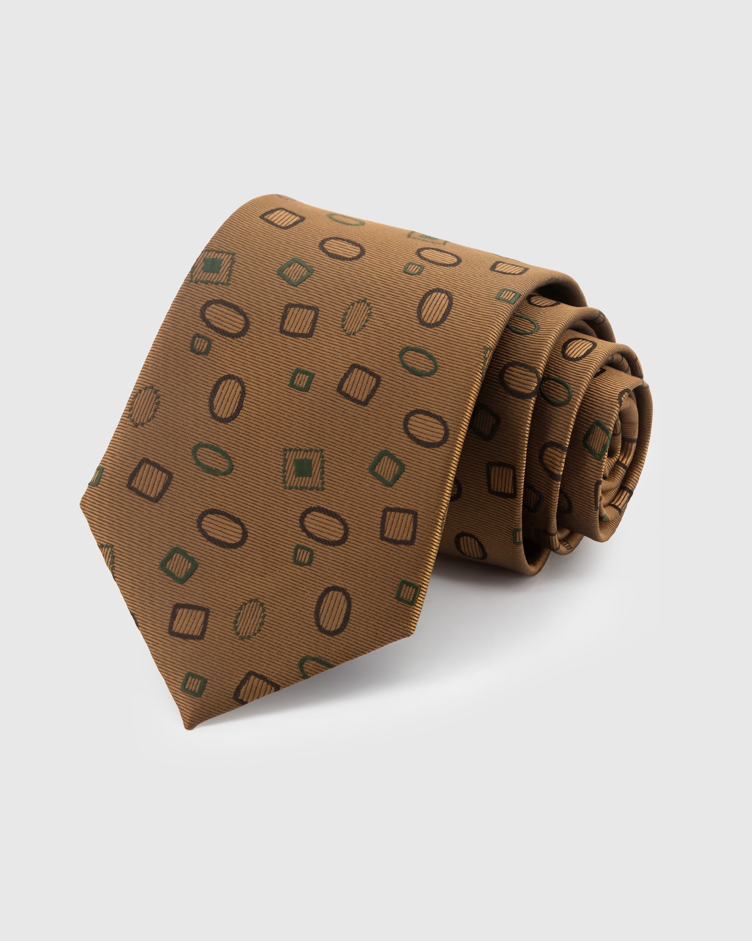 STICKYZOO Caramel Geo Scatter Tie in hand-embroidered mulberry silk with geometric shapes on twill ground, 45° bias-cut