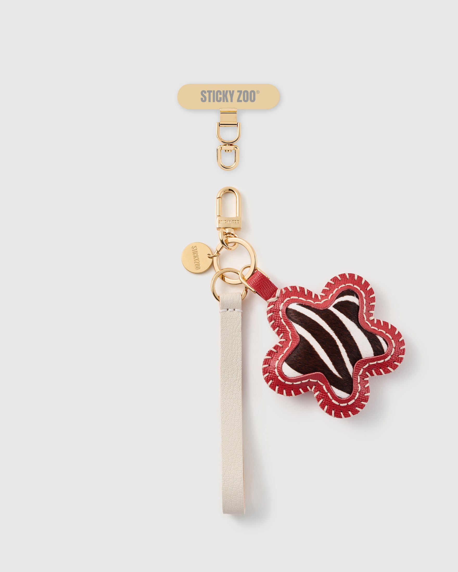 STICKYZOO zebra star leather phone strap, ivory strap with calf-hair star and gold hook