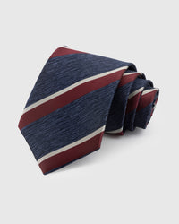 NAVY BORDEAUX STRIPE TIE — Hand-embroidered regimental stripe detail on 100% mulberry silk in navy, showing embroidery texture and silk sheen