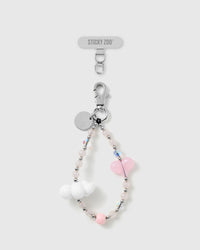 Handmade pastel pink heart and cloud bead phone strap by STICKYZOO with silver-tone engraved hardware, shown with the Phone Strap Card