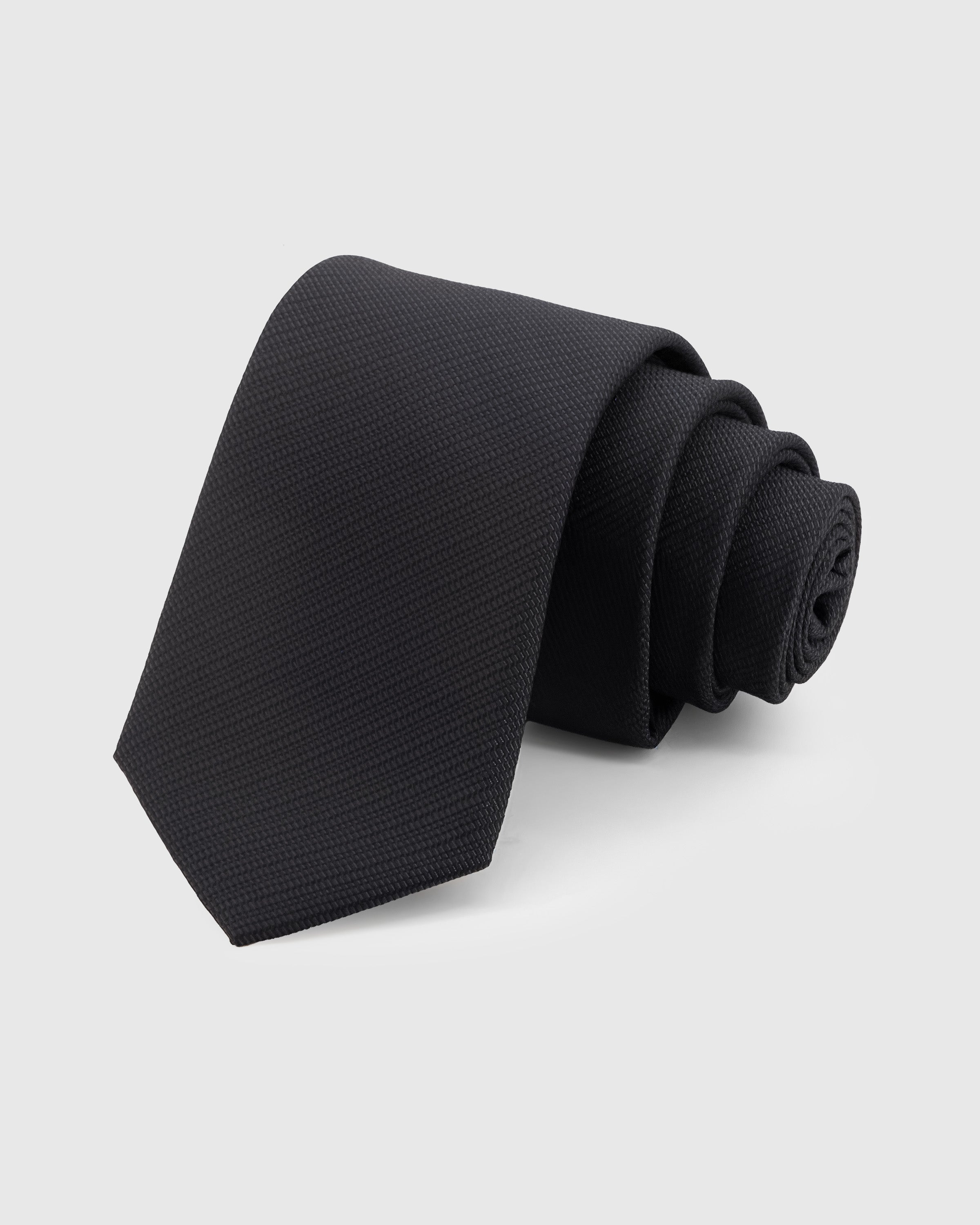 STICKYZOO Obsidian Solid Tie in 100% mulberry silk with micro-piqué weave texture in deep obsidian, 45° bias-cut Italian method