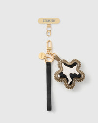 STICKYZOO cow star leather phone strap, black strap with black-and-white calf-hair star and gold hook