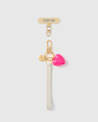 Handmade French Alran ivory leather phone strap with glossy hot pink puff heart charm and 18K gold STICKYZOO hardware