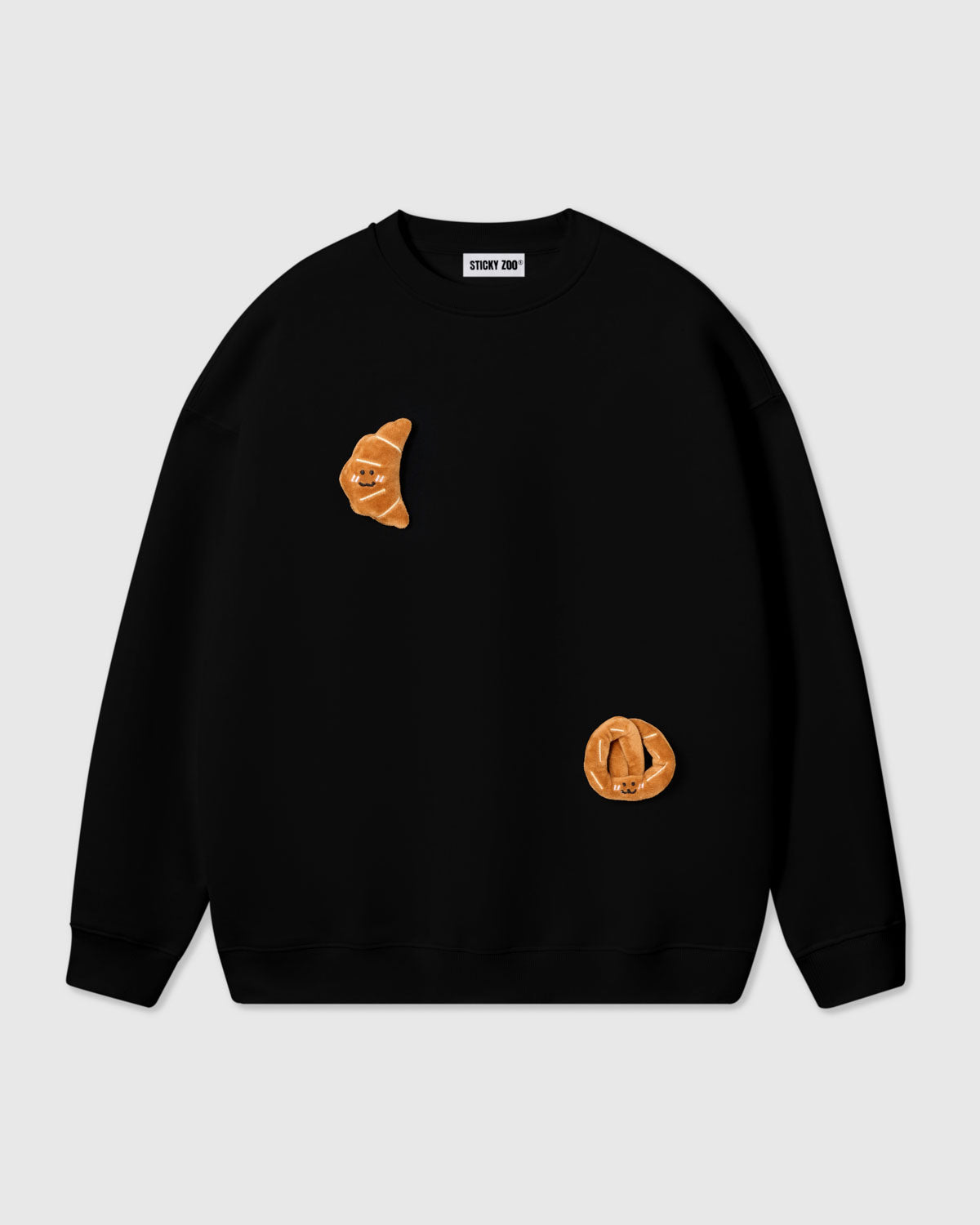 {{2 plush croissants in black}} STICKYZOO DOUBLE CROISSANT SWEATSHIRT in Black featuring 2 hand-stitched plush croissants, designed in Amsterdam